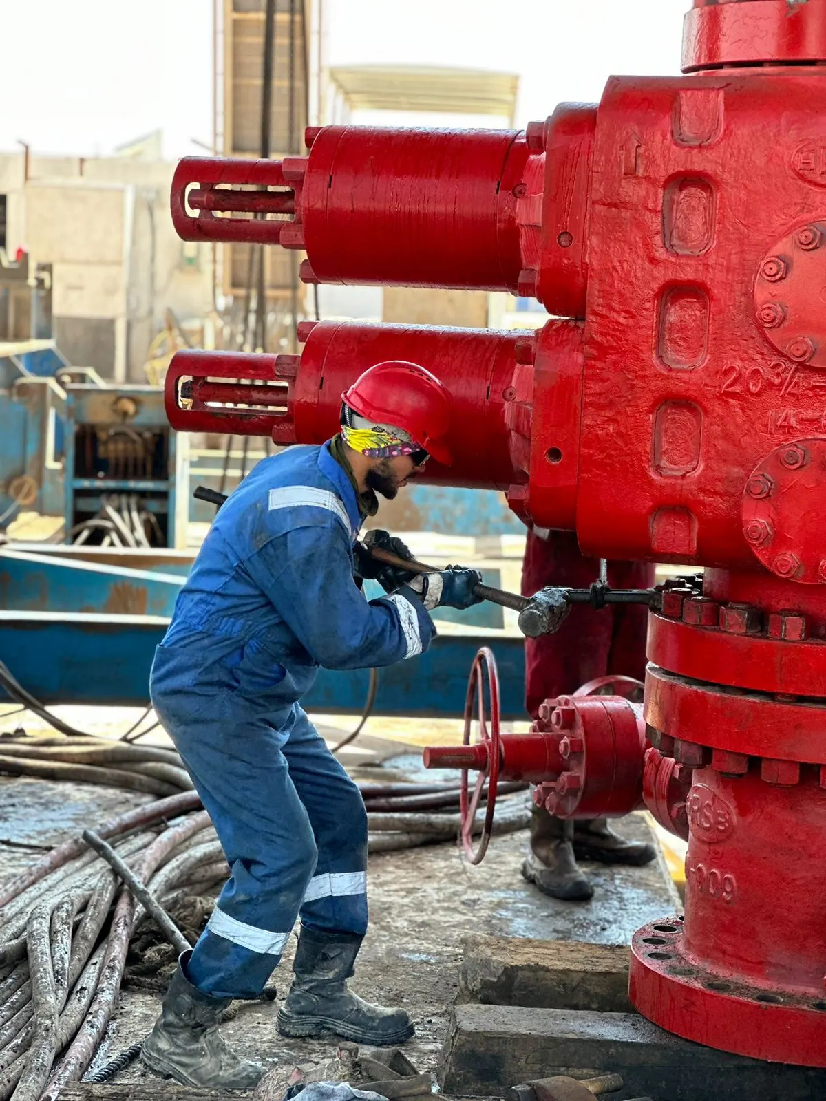 Technician working on wellhead valves